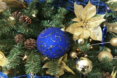 Photo of blue and gold decorated Christmas tree