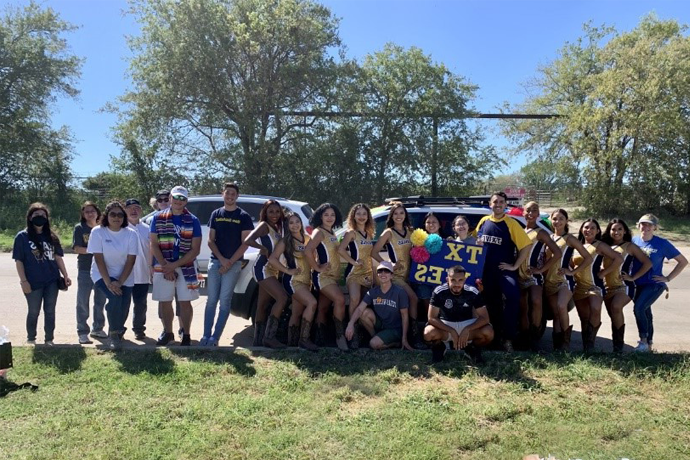 A group of Texas Wesleyan students and faculty at the 2022 Fort Worth Fiestas Patrias Parade